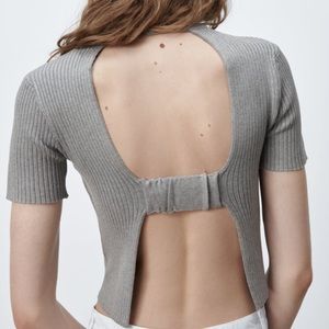Knit top with back opening